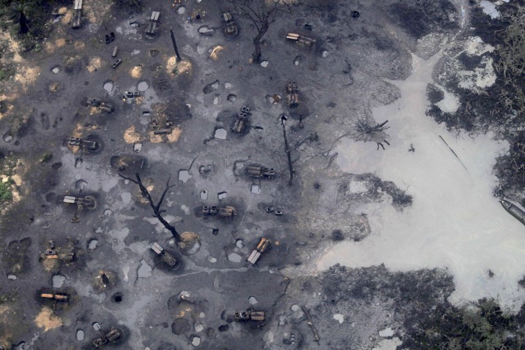 Image: A view of an illegal oil refinery is seen in Ogoniland outside Port Harcourt in Nigeria's Delta region